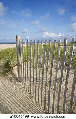 Weathered wooden fence on sand dune. View Large Photo Image Stock Photo - Weathered wooden fence on sand dune.. Fotosearch