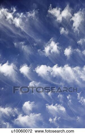Stock Image - Blue sky and clouds over Maui, Hawaii, USA.. Fotosearch