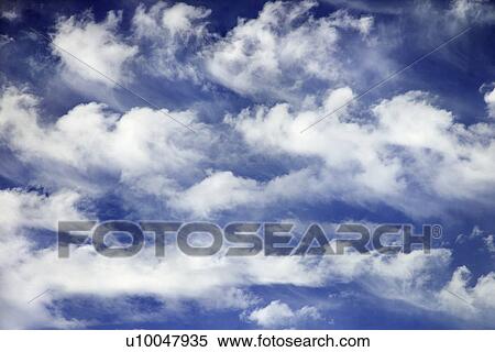 Stock Photography - Blue sky and clouds over Maui, Hawaii, USA.. Fotosearch