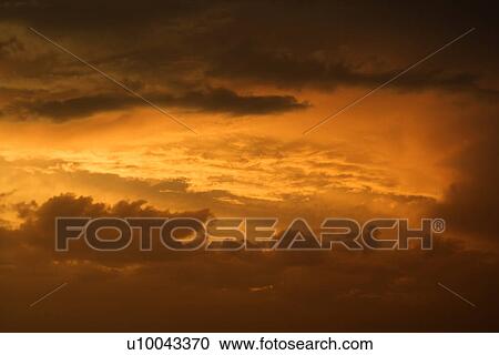 Golden yellow and orange sunset sky and clouds. View Large Photo Image Stock Image - Golden yellow and orange sunset sky and clouds.. Fotosearch