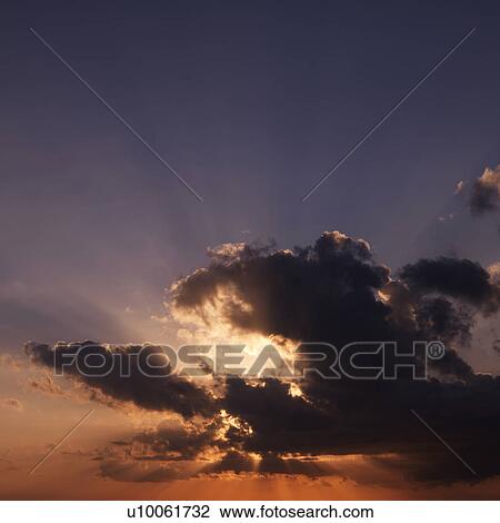 Sun shining through dark cloud. View Large Photo Image Stock Image - Sun shining through dark cloud.. Fotosearch