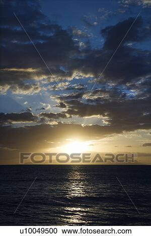 Sunset and clouds over the Pacific Ocean off the coast of Kihei, Maui, Hawaii, USA. View Large Photo Image Stock Image - Sunset and clouds over the Pacific Ocean off the coast of Kihei, Maui, Hawaii, USA.. Fotosearch