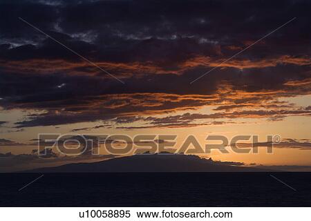 Sunset over Pacific Ocean with clouds in Maui, Hawaii, USA. View Large Photo Image Stock Photography - Sunset over Pacific Ocean with clouds in Maui, Hawaii, USA.. Fotosearch
