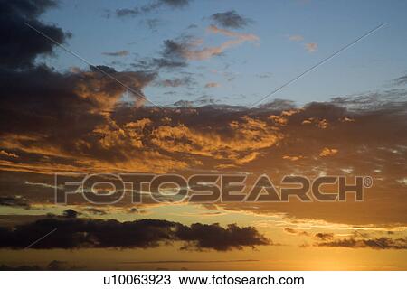 Stock Image - Sunset sky over Kihei, Maui, Hawaii, USA.. Fotosearch