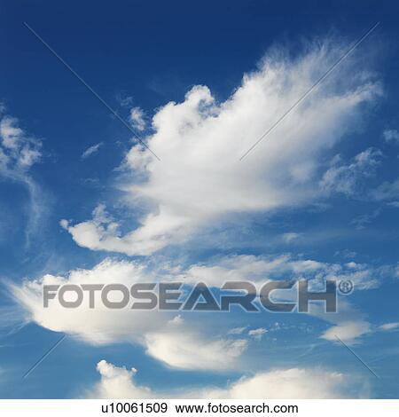 Wispy cloud formations against clear blue sky. View Large Photo Image Stock Photo - Wispy cloud formations against clear blue sky.. Fotosearch