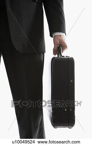 Caucasian mid-adult man's hand holding briefcase. View Large Photo Image Picture - Caucasian mid-adult man's hand holding briefcase.. Fotosearch