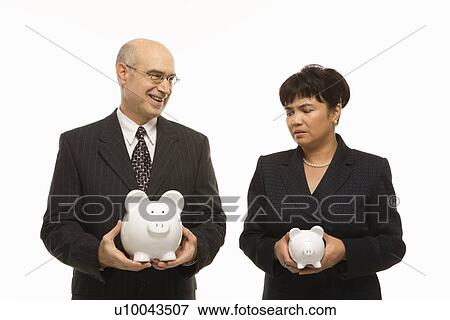 Caucasian middle-aged businessman and Filipino businesswoman holding different sized piggybanks. View Large Photo Image Stock Photo - Caucasian middle-aged businessman and Filipino businesswoman holding different sized piggybanks.. Fotosearch