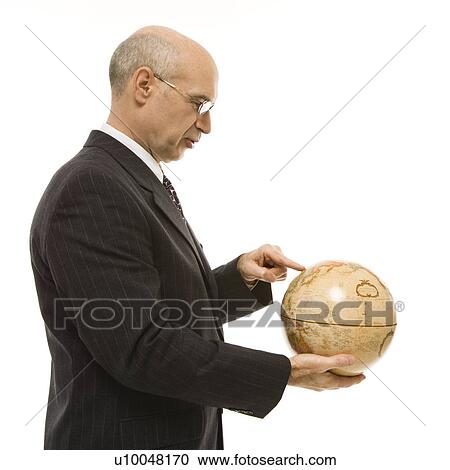 Caucasian middle-aged businessman holding globe and pointing standing in front of white background. View Large Photo Image Stock Image - Caucasian middle-aged businessman holding globe and pointing standing in front of white background.. Fotosearch