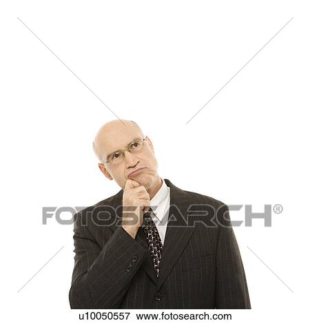 Caucasian middle-aged businessman looking thoughtful standing against white background. View Large Photo Image Stock Photo - Caucasian middle-aged businessman looking thoughtful standing against white background.. Fotosearch