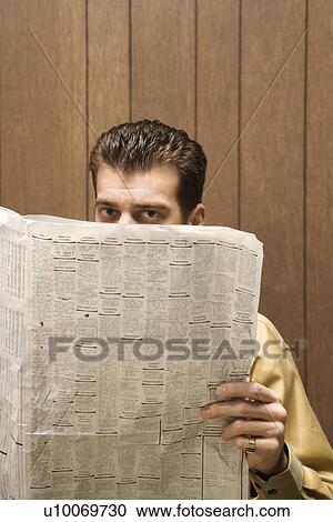 Caucasion mid-adult retro businessman peeking over top of newspaper. View Large Photo Image Stock Image - Caucasion mid-adult retro businessman peeking over top of newspaper.. Fotosearch