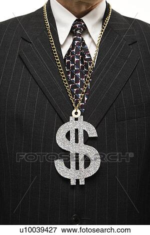 Close-up of Caucasian middle-aged businessman wearing chain necklace with oversized dollar sign. View Large Photo Image Stock Photo - Close-up of Caucasian middle-aged businessman wearing chain necklace with oversized dollar sign.. Fotosearch