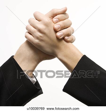 Stock Photo - Close-up of hands of Caucasian man and woman arm wrestling.. Fotosearch