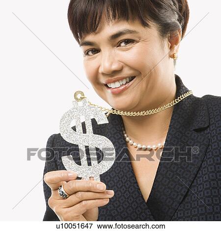 Stock Photo - Smiling Filipino middle-aged businesswoman wearing chain necklace with oversized dollar sign.. Fotosearch