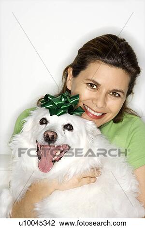 Caucasian prime adult female holding fluffy white dog. View Large Photo Image Stock Image - Caucasian prime adult female holding fluffy white dog.. Fotosearch