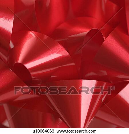 Close-up of big red Christmas bow. View Large Photo Image Stock Image - Close-up of big red Christmas bow.. Fotosearch