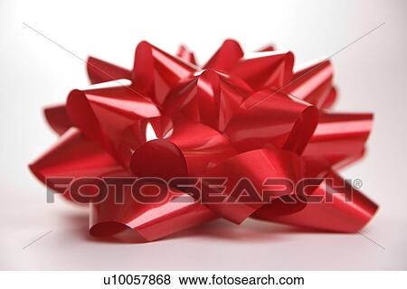 Stock Photo - Still life of big red Christmas bow.. Fotosearch
