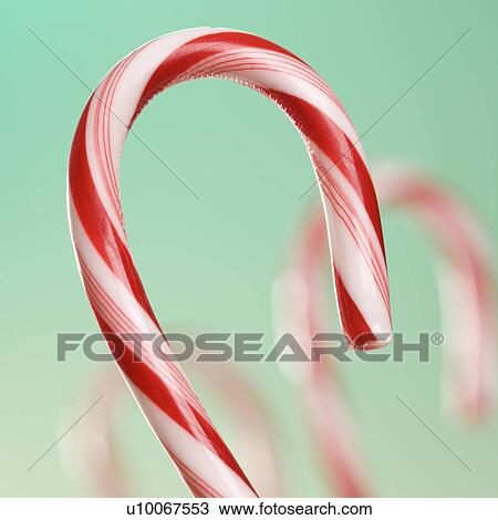 Still life of candy cane with blurred out candy canes in background. View Large Photo Image Stock Image - Still life of candy cane with blurred out candy canes in background.. Fotosearch