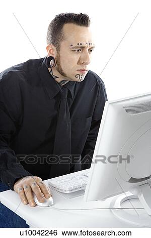 Caucasian mid-adult man with tattoos and piercings using computer. View Large Photo Image Stock Photograph - Caucasian mid-adult man with tattoos and piercings using computer.. Fotosearch