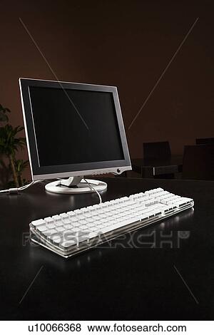 Computer monitor and keyboard on desktop. View Large Photo Image Stock Photo - Computer monitor and keyboard on desktop.. Fotosearch