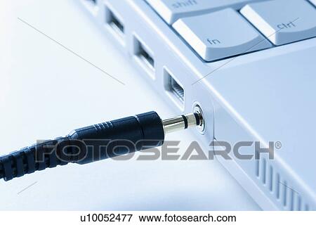 Headphone wire connecting to laptop computer. View Large Photo Image Stock Photo - Headphone wire connecting to laptop computer.. Fotosearch