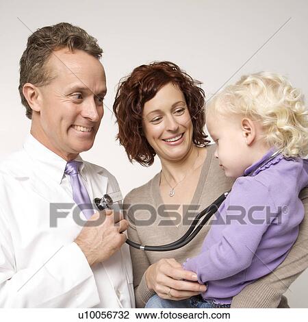 Caucasian female toddler with stethoscope around her neck as middle-aged male doctor holds it to his chest. View Large Photo Image Stock Image - Caucasian female toddler with stethoscope around her neck as middle-aged male doctor holds it to his chest.. Fotosearch