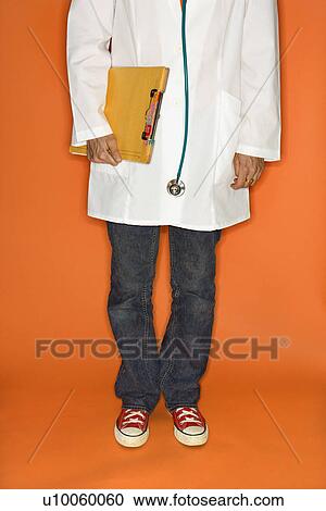 Doctor wearing jeans and sneakers. View Large Photo Image Stock Image - Doctor wearing jeans and sneakers.. Fotosearch