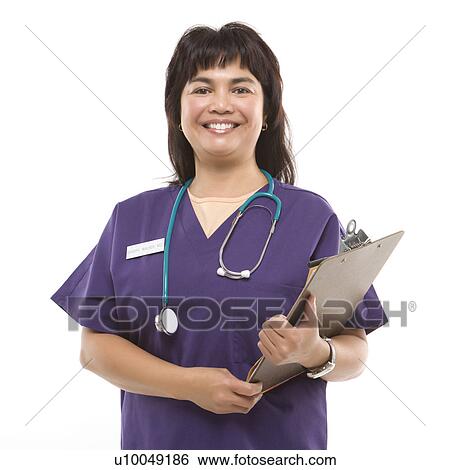 Stock Photograph - Middle-aged Filipino woman dressed in scrubs with stethoscope and clipboard.. Fotosearch