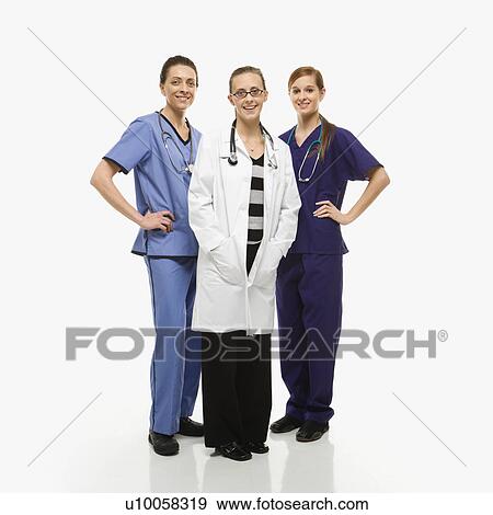 Portrait of smiling Caucasian women medical healthcare workers in uniforms standing against white background. View Large Photo Image Stock Photo - Portrait of smiling Caucasian women medical healthcare workers in uniforms standing against white background.. Fotosearch