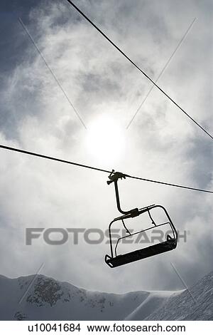 Empty chair lift at ski resort. View Large Photo Image Picture - Empty chair lift at ski resort.. Fotosearch