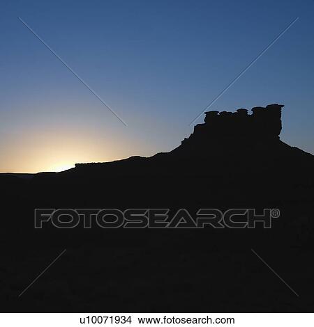 Picture - Silhouette of Garden of the Gods rock formation at dusk in Monument Valley, Utah.. Fotosearch