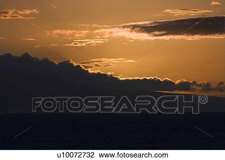Sunset over Pacific Ocean with clouds in Maui, Hawaii, USA. View Large Photo Image Stock Image - Sunset over Pacific Ocean with clouds in Maui, Hawaii, USA.. Fotosearch