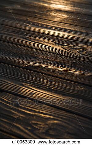 Sunset reflected on wood. View Large Photo Image Stock Photo - Sunset reflected on wood.. Fotosearch