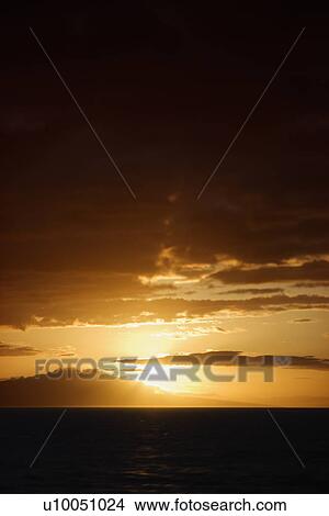 Sunset view of Pacific Ocean and Kihei island in Maui, Hawaii, USA. View Large Photo Image Picture - Sunset view of Pacific Ocean and Kihei island in Maui, Hawaii, USA.. Fotosearch