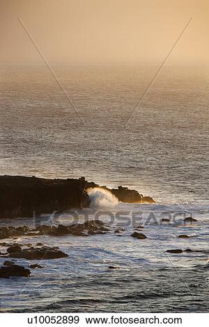 Waves on rocky shore in Maui, Hawaii. View Large Photo Image Stock Photo - Waves on rocky shore in Maui, Hawaii.. Fotosearch