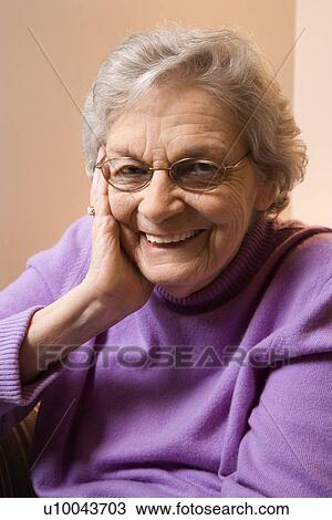 Elderly Caucasian woman smiling with hand on face. View Large Photo Image Stock Image - Elderly Caucasian woman smiling with hand on face.. Fotosearch