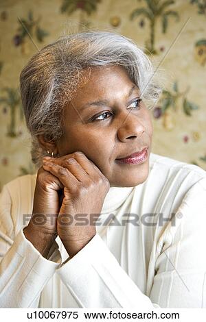 Portrait of mature African American woman looking to the side. View Large Photo Image Stock Photography - Portrait of mature African American woman looking to the side.. Fotosearch