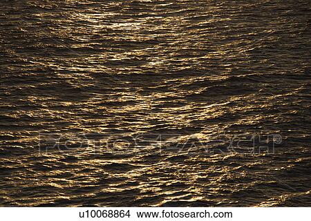 Picture - Sun reflected on ocean.. Fotosearch