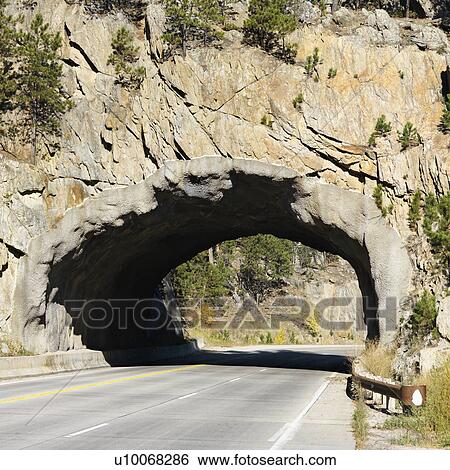 Tunnel going through rocks in South Dakota. View Large Photo Image Stock Photograph - Tunnel going through rocks in South Dakota.. Fotosearch