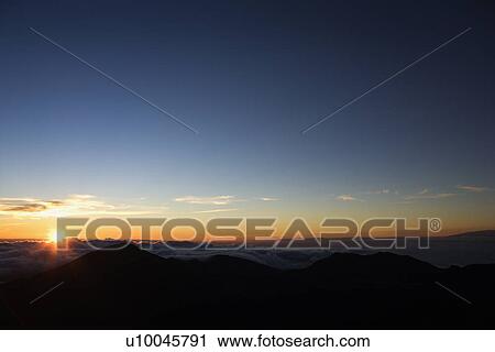 Aerial of sunrise in Haleakala National Park in Maui, Hawaii. View Large Photo Image Stock Image - Aerial of sunrise in Haleakala National Park in Maui, Hawaii.. Fotosearch