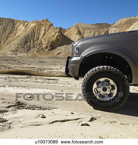 Four wheel drive truck in desert landscape in Death Valley National Park. View Large Photo Image Stock Photo - Four wheel drive truck in desert landscape in Death Valley National Park.. Fotosearch