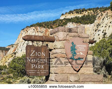Wooden and stone sign for Zion National Park, Utah with rocky cliffs in the background. View Large Photo Image Stock Photography - Wooden and stone sign for Zion National Park, Utah with rocky cliffs in the background.. Fotosearch