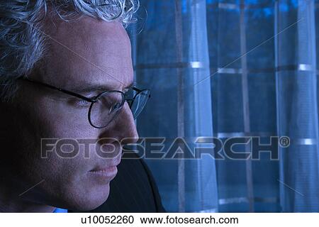 Blue tone close up profile of prime adult Caucasian man in suit. View Large Photo Image Stock Image - Blue tone close up profile of prime adult Caucasian man in suit.. Fotosearch
