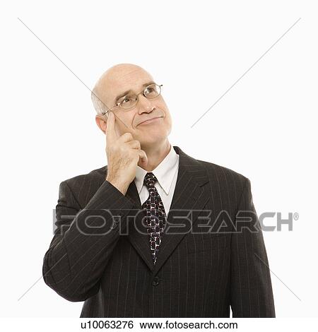Caucasian middle-aged businessman with hand to head looking thoughtful standing against white background. View Large Photo Image Stock Photograph - Caucasian middle-aged businessman with hand to head looking thoughtful standing against white background.. Fotosearch