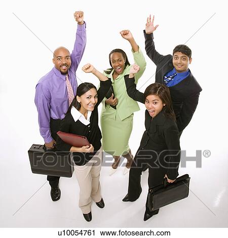 Stock Image - Portrait of multi-ethnic business group standing holding briefcases and cheering.. Fotosearch