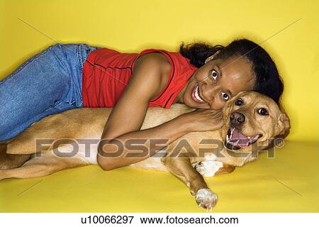 African American prime adult female hugging dog. View Large Photo Image Stock Photo - African American prime adult female hugging dog.. Fotosearch