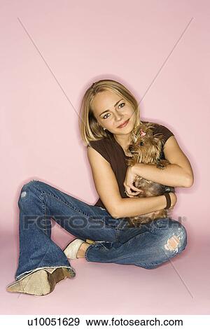 Stock Photo - Caucasian young adult female with Yorkshire Terrier dog.. Fotosearch