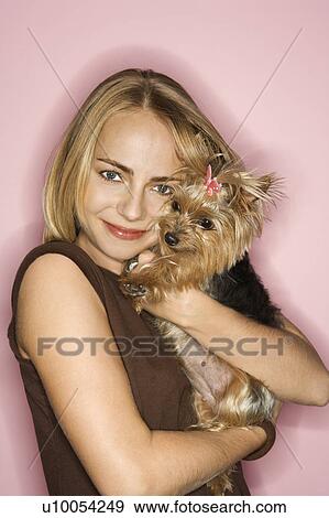 Stock Photo - Caucasian young adult female with Yorkshire Terrier dog.. Fotosearch