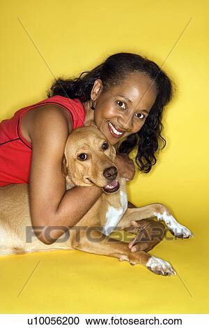 African American prime adult female hugging dog. View Large Photo Image Stock Image - African American prime adult female hugging dog.. Fotosearch