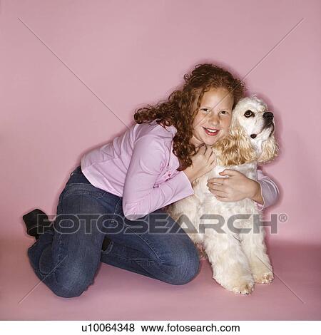 Caucasian female child hugging Cocker Spaniel dog. View Large Photo Image Stock Photo - Caucasian female child hugging Cocker Spaniel dog.. Fotosearch