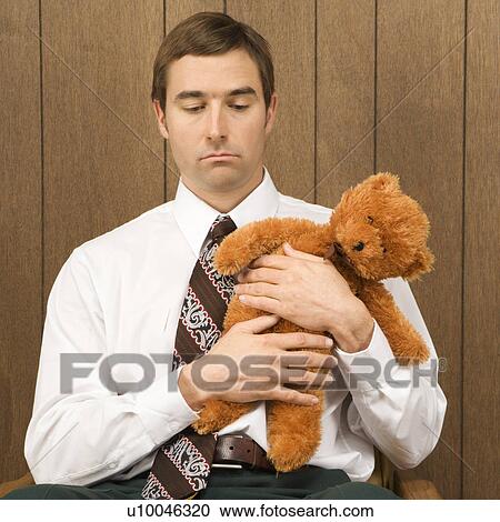 holding a stuffed animal